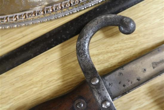 Three late 19th century French bayonets, a US Army bayonet, an EFD 1892 bayonet and an epee